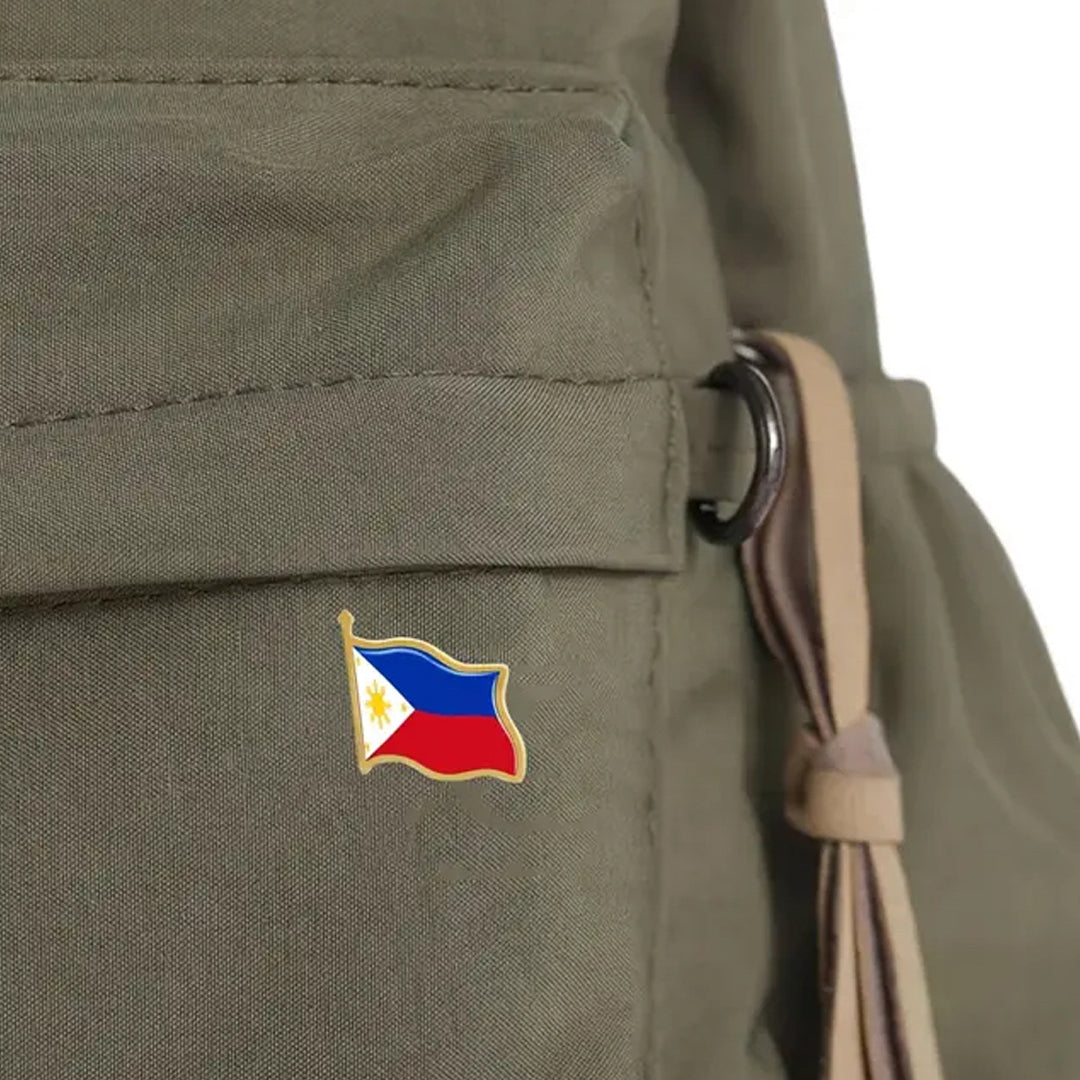 This gold-plated, enamel-filled lapel pin allows you to proudly display the Philippines flag while honouring all those who have served or are currently serving in all theatres of war and peacekeeping efforts. Featuring the Philippines Flag, it symbolises both national pride and remembrance. www.moralepatches.com.au