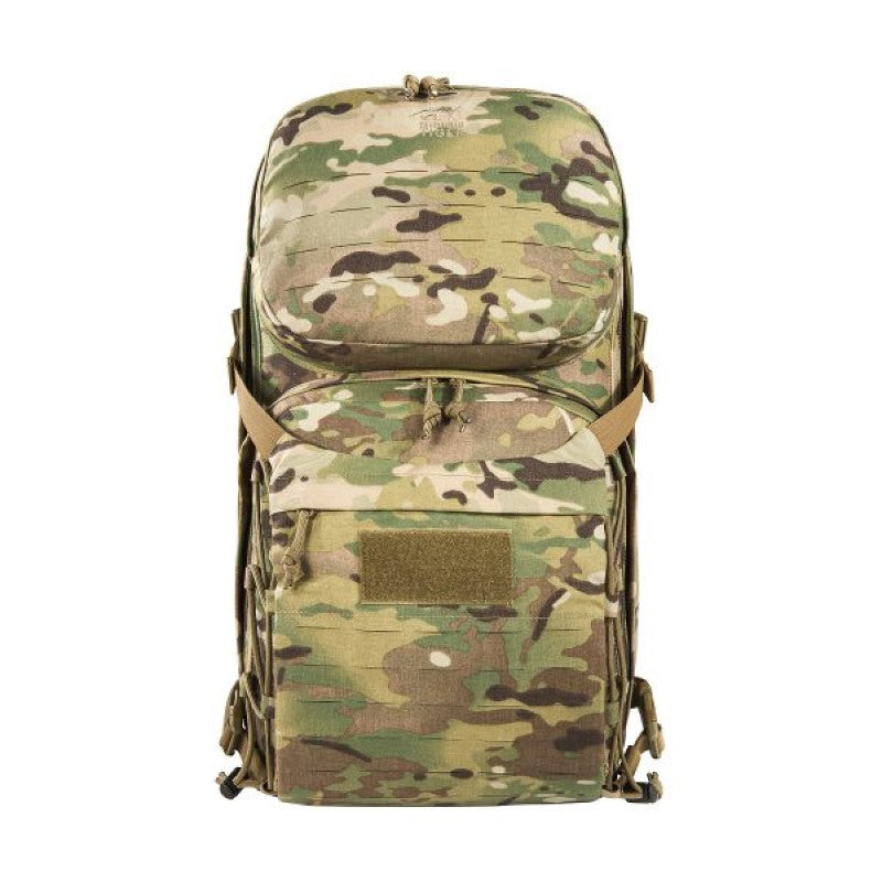 The Tasmanian Tiger Modular Radio Pack Multicam features exterior pouches and a front flap with a zippered pocket. The included removable hip belt can also double as a Warrior Belt, while the radio holder can be easily adjusted for height and width. Top zippered openings provide quick access, while the shoulder straps include cable guides and ports. www.moralepatches.com.au