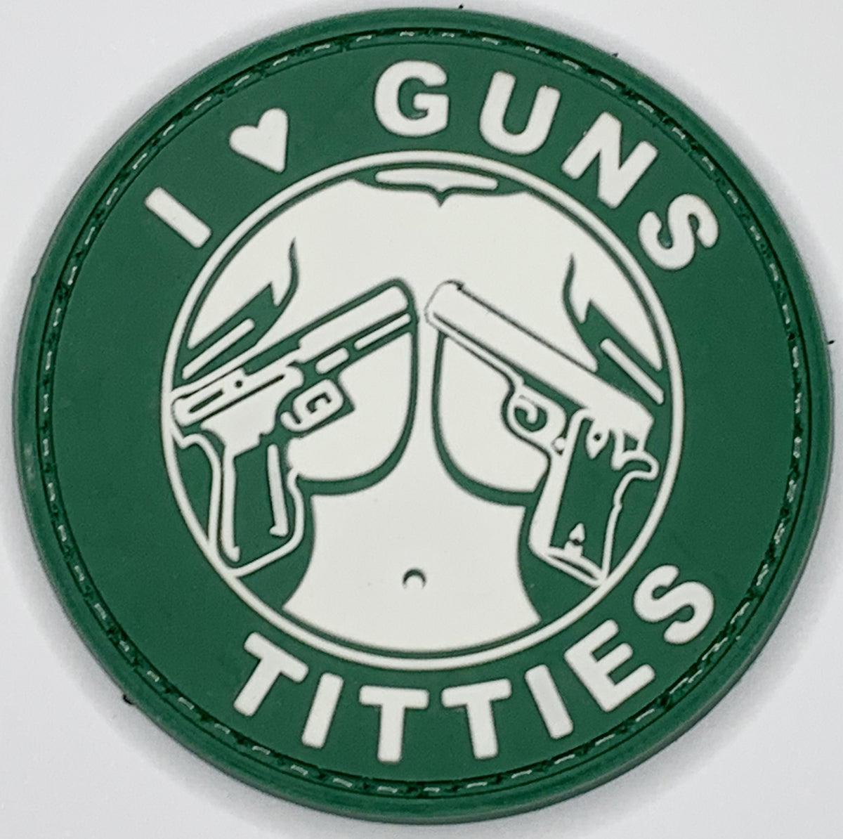 I Love Guns and Titties PVC Patch, Velcro backed Badge. Great for attaching to your field gear, jackets, shirts, pants, jeans, hats or even create your own patch board. Size: 6cm