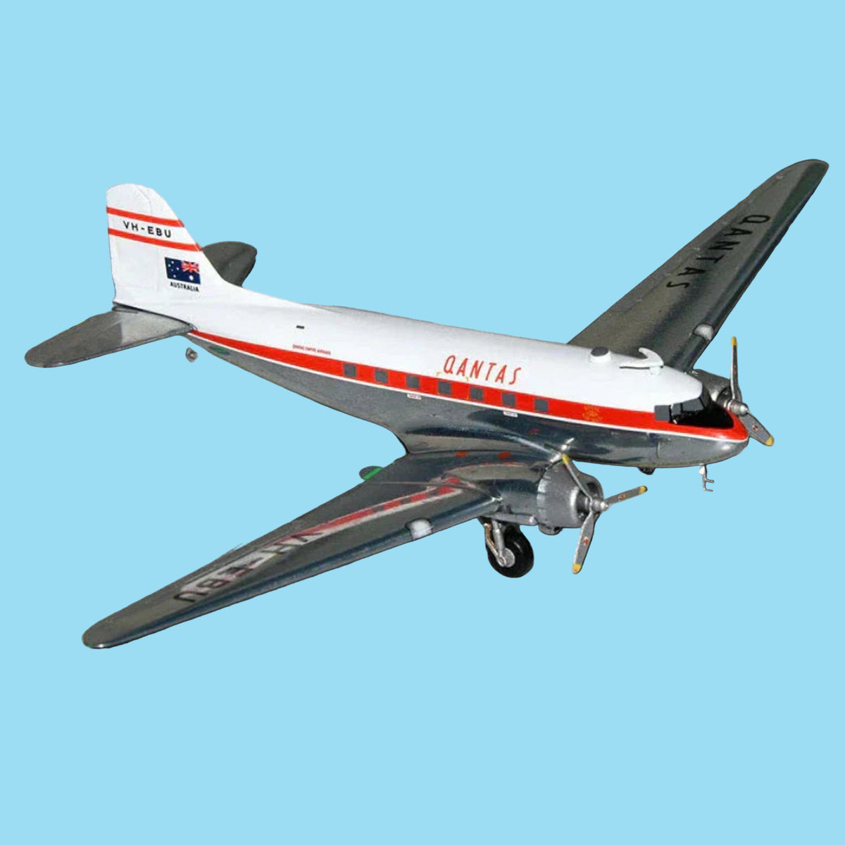 Step back in time with this gleaming 1/200 scale Qantas DC-3 from Gemini Jets, featuring the polished aluminium finish of aircraft VH-EBU. This exquisitely detailed collectible honours the legendary Douglas transport that pioneered commercial aviation in Australia, rendered with authentic period accuracy and lustrous detail. www.moralepatches.com.au