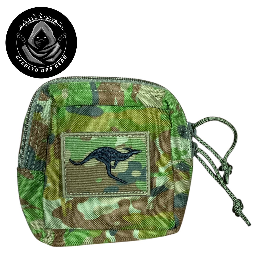 The AMCU Small Kit Pouch Stealth Ops Gear is an essential accessory for anyone needing quick access to small items without sacrificing space or comfort. Its compact dimensions of 12x11.5x6cm make it easy to attach to your belt, vest, or backpack without adding unnecessary bulk. www.moralepatches.com.au
