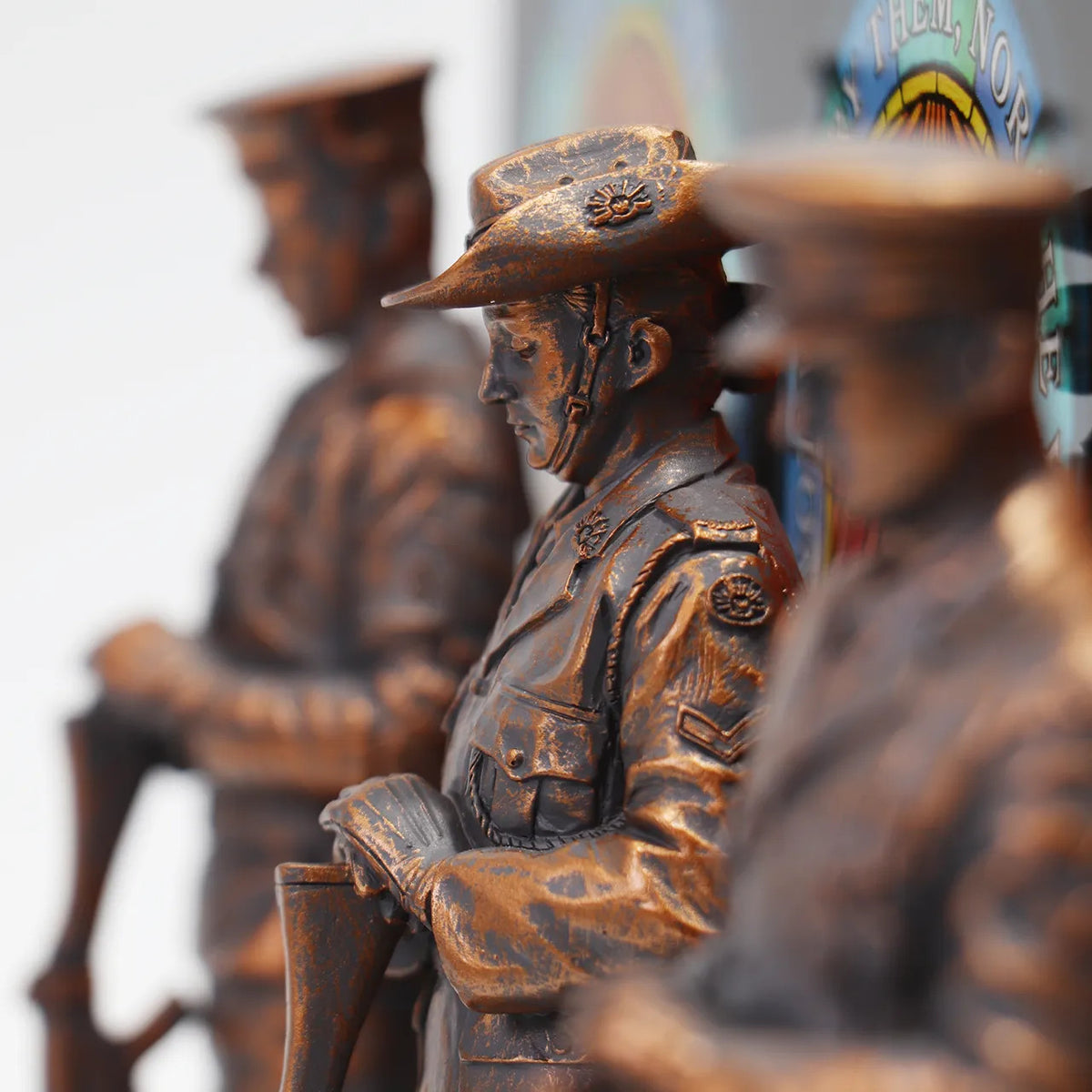 This stunning Courage, Honour, Sacrifice: We Will Remember Them* figurine is a remarkable tribute, crafted with exquisite attention to detail. The figurines, made from cold cast bronze, beautifully depict personnel from the Royal Australian Navy, Australian Army, and Royal Australian Air Force, all captured in a solemn Resting on Reversed Arms stance. www.moralepatches.com.au