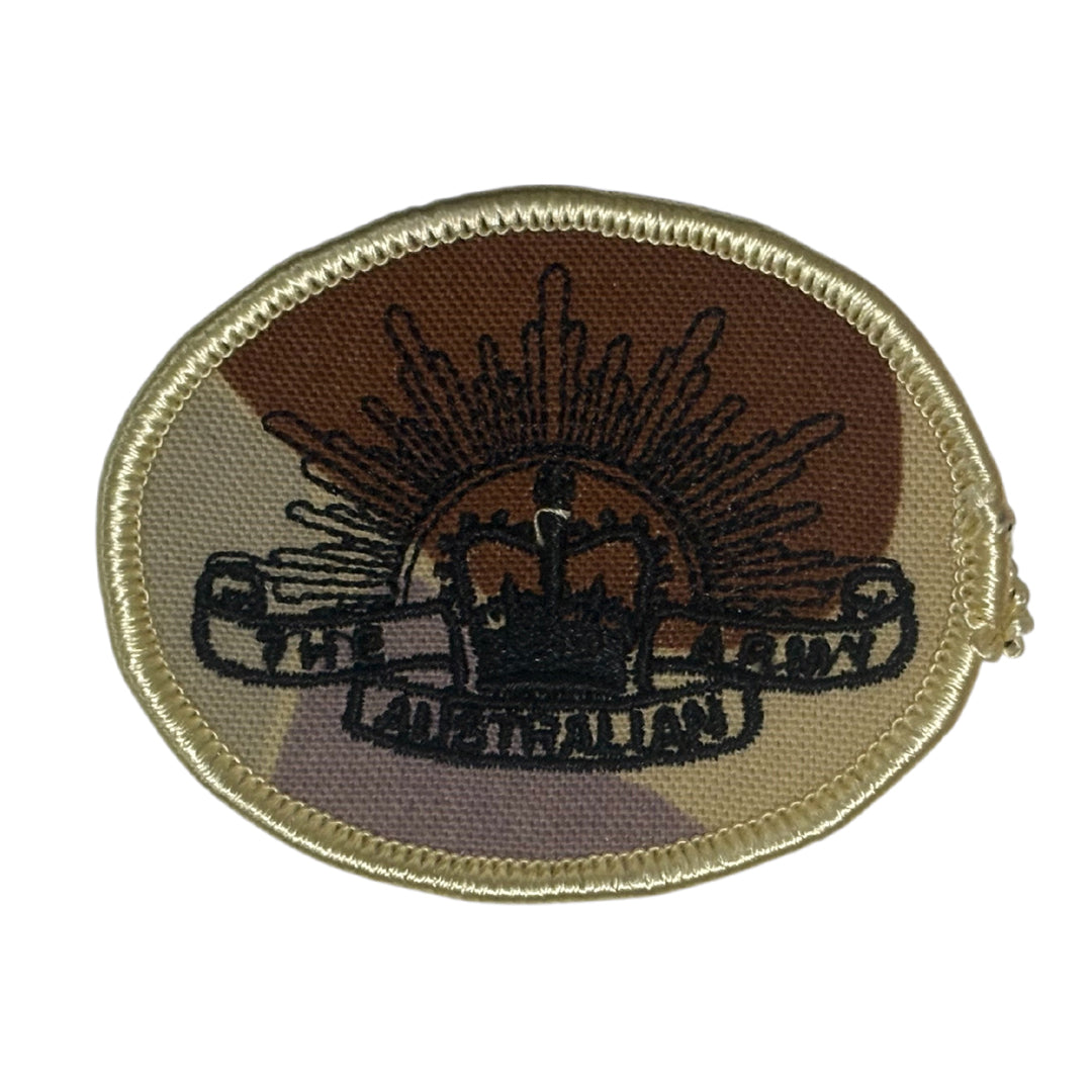 This DPDU Australian Army Rising Sun Biscuit Shoulder Patch, sized at 6.5cm by 4.7cm, features a plain backing that ensures easy application on uniforms, providing a subtle yet authentic military touch. www.moralepatches.com.au