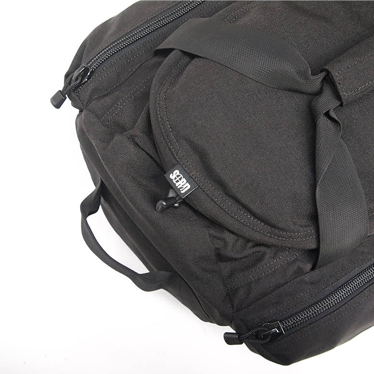 Constructed of heavy duty 1000 Denier Cordura, YKK #10 zips, Removable shoulder straps and "soft" seat belt carry straps for enhanced comfort and strength. Large main compartment with double zipped opening, two zipped side compartments. www.moralepatches.com.au