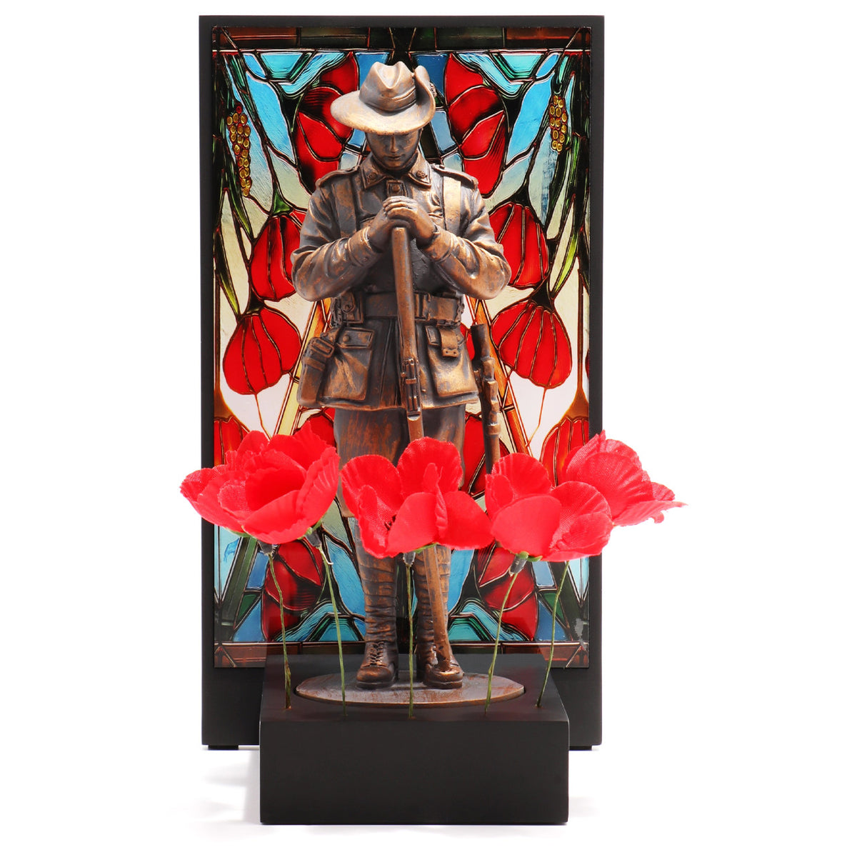 This beautifully crafted miniature figurine is a poignant tribute to our fallen soldiers. It comes with a striking acrylic backdrop, featuring an intricate stained-glass poppy design that adds depth and significance to the piece. www.moralepatches.com.au