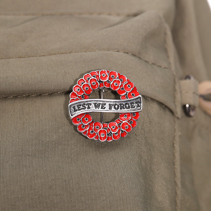 Honour the fallen with the Lest We Forget Poppy Wreath Gold Front Brooch—a striking tribute that blends timeless remembrance with contemporary style. This exquisite 28mm brooch features a multi-dimensional design with deep translucent red petals set against luxurious silver plating, creating a piece that commands attention and respect. Perfect for Anzac Day, memorial services, or everyday wear, this brooch lets you carry your tribute with pride. www.moralepatches.com.au