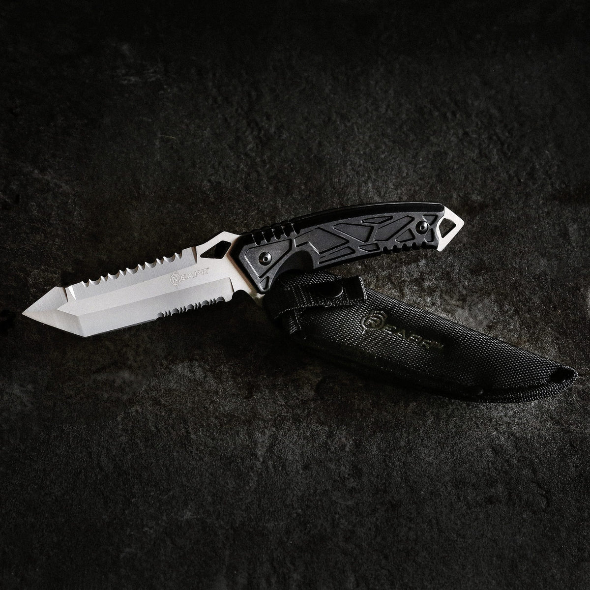 This serrated full tang knife is the ideal camping and hunting companion. The REAPR 11011 Javelin Fixed Blade Knife features a spiked window glass breaker and a sawed-back dual edge serrated camping knife for cutting twigs and twine and branches. www.moralepatches.com.au