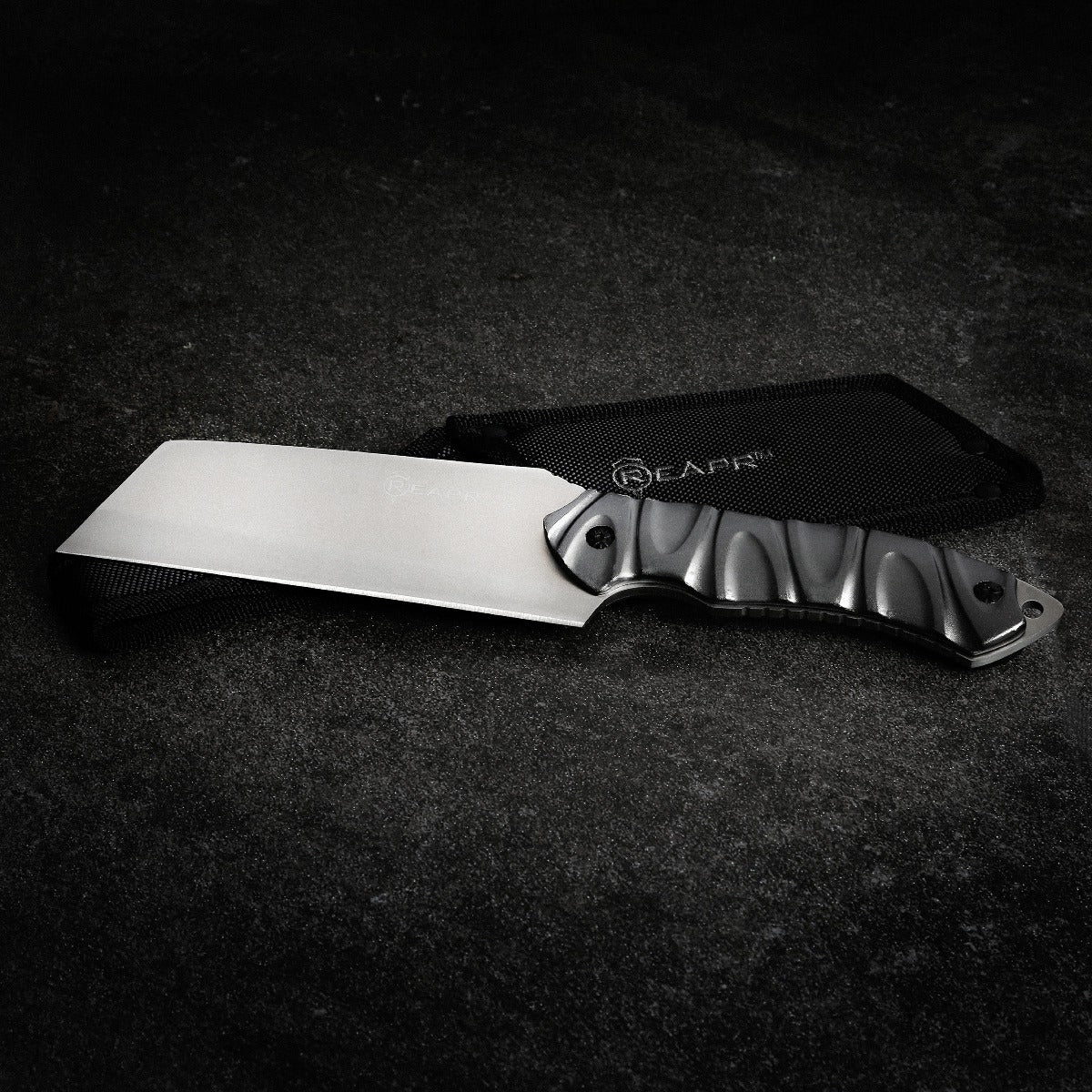 The Reapr JAMR Knife is the ultimate in versatile, tactical fixed-blade knives. The JAMR features an industry first modified cleaver blade, combining the functions of a cleaver, drop point knife and reverse tanto blade to meet a variety of demands, whether as a hunting knife, camping knife, and for guiding, tactical and survival use. www.moralepatches.com.au