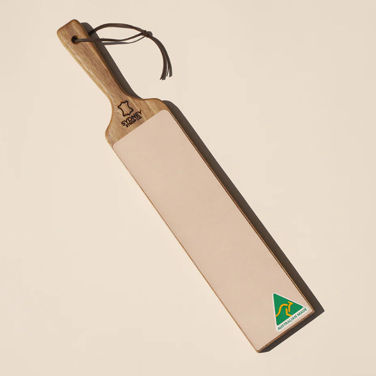 The paddle-style handle offers excellent grip and control, allowing for consistent, safe stropping. Ideal for straight razors, pocket knives, chisels, and woodworking tools, this strop efficiently removes burrs and enhances edge sharpness to a refined, mirror-like finish. www.moralepatches.com.au