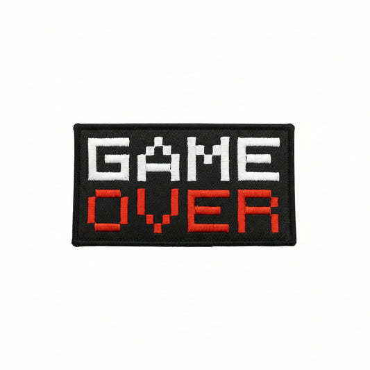 Dominate your gear with this striking Game Over Large Embroidery Morale Patch Hook &amp; Loop&nbsp;, engineered for serious operators. Measuring 10.1x5.1cm, it features dual-sided hook and loop backing—both included—so you can attach it securely to tactical vests, bags, or uniforms and reposition as needed. Built tough for the field, this patch delivers attitude and functionality in one compact package. www.moralepatches.com.au