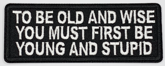 To be old and wise, you must first be young and stupid Iron On Patch. Great for attaching to your jackets, shirts, pants, jeans, hats.  Size: 10.4X4cm