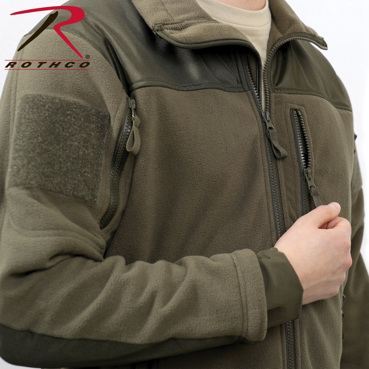 100% Heavyweight Polyester Fleece Interior Tricot Lining For Added Warmth All Pockets Feature Zipper Closures And Zipper Pulls 2 Shoulder Pockets With 3 ¾” Square Loop Field For Patches Left Chest Pocket And 2 Front Slash Pockets Mandarin Collar And Hanging Hook Internal Main Zipper Flap Drawstring Waist For Comfortable Fit Foldout Cuffs With Thumbholes Keep Sleeves In Place Shoulder And Forearm Yokes