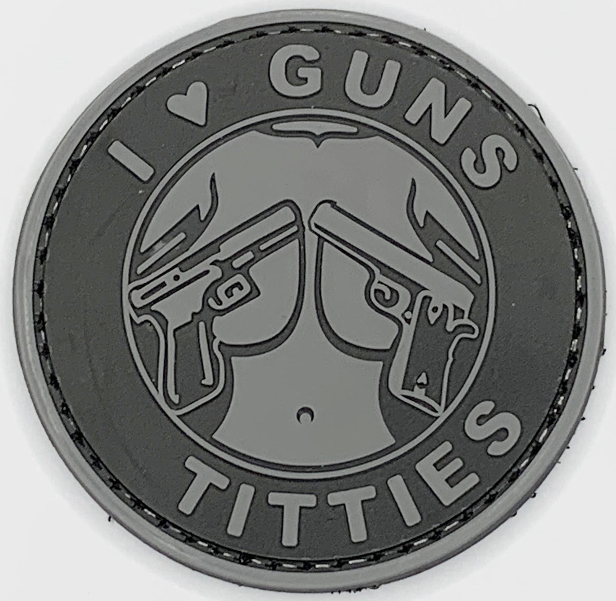 I Love Guns and Titties PVC Patch, Velcro backed Badge. Great for attaching to your field gear, jackets, shirts, pants, jeans, hats or even create your own patch board.  Size: 6cm